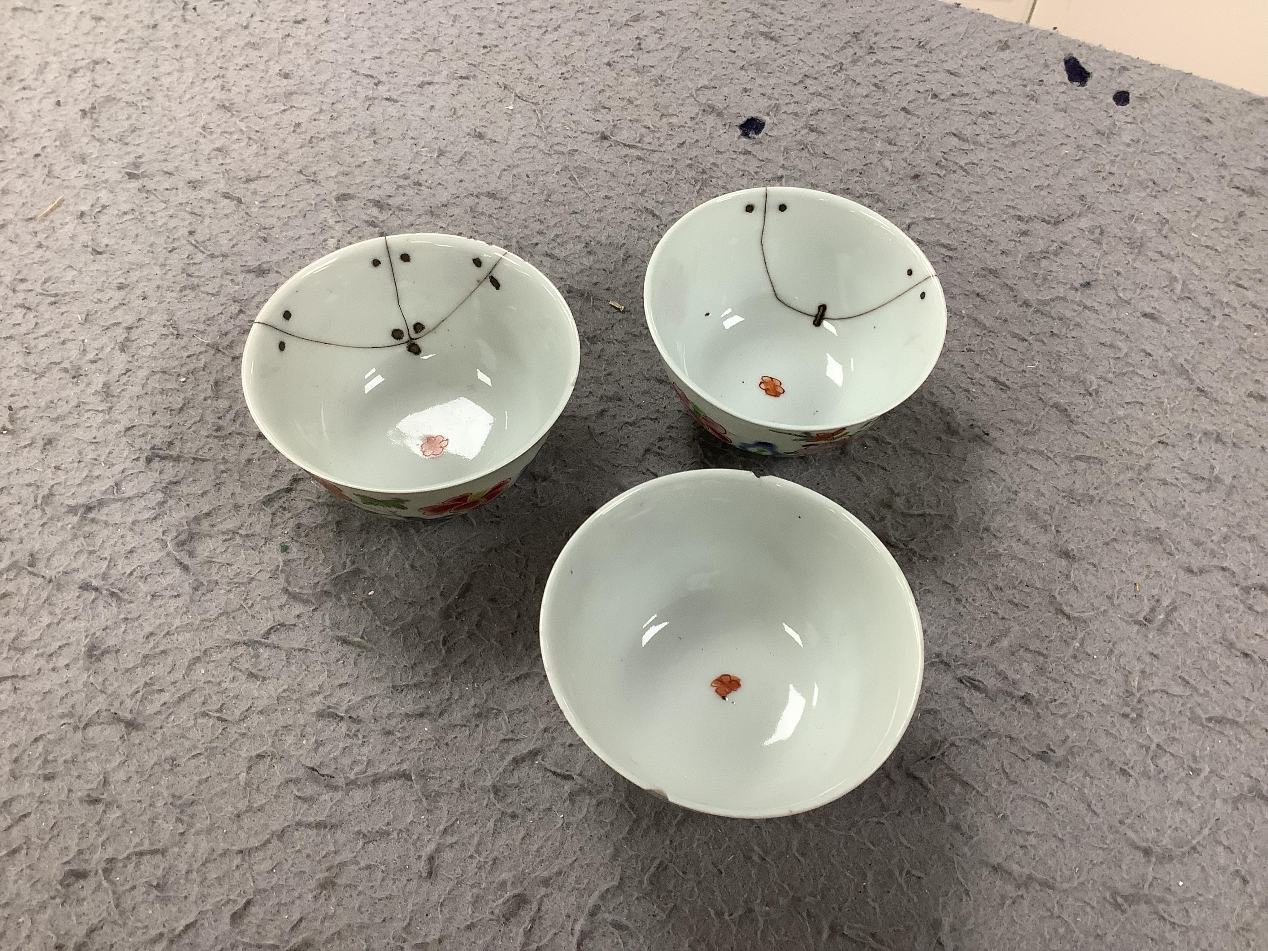 An 18th century Chinese porcelain teapot and a set of tea bowls and saucers, teapot 13cm high. Condition - mixed poor to fair